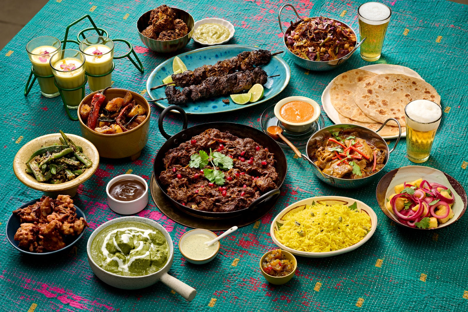 A South Indian feast — dosa, curries and coastal fish plated together.